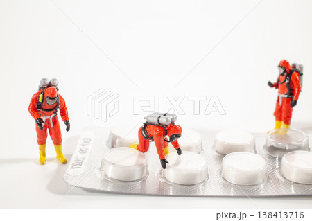 Miniature hazmat team inspecting oversized USB cable 138413716