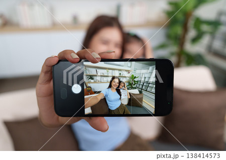 Mother and child taking a selfie on Mother's Day 138414573