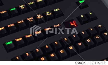 Finger Pressing Arrow to Change Lighting Console Preset in 4K Finger Pressing Arrow to Change Lighting Console Preset in 4K 138415163