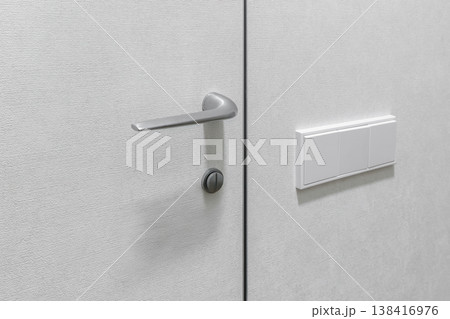 Modern Silver Door Handle without Rosette on Grey Texture Panel 138416976