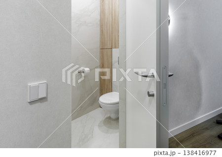 Minimalist Silver Door Handle and Lock Detail on Modern White Door Minimalist Silver Door Handle and Lock Detail on Modern White Door 138416977