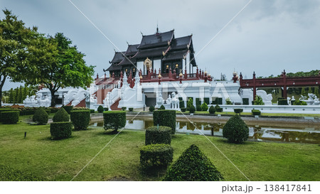 Traditional Thai temple pavilion with garden and pond at Royal Park Rajapruek, Ornate palace architecture with symmetrical landscape and greenery in Chiang Mai 138417841