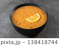Turkish lentil soup ezogelin with lemon and dried mint on a gray background. close up. 138418744