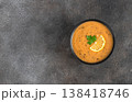 Turkish lentil soup ezogelin with lemon and dried mint on a gray background. Copy space. Top view. 138418746