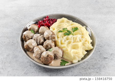 Swedish meatballs with creamy sauce, mashed potatoes and lingonberries. Swedish cuisine Swedish meatballs with creamy sauce, mashed potatoes and lingonberries. Swedish cuisine 138418750