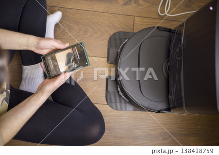 Automated Cleaning With Mobile Control. Advanced Home Automation System With Robotic Vacuum And Userfriendly Smartphone Interface For Hardwood Floor Maintenance Automated Cleaning With Mobile Control. Advanced Home Automation System With Robotic Vacuum And Userfriendly Smartphone Interface For Hardwood Floor Maintenance 138418759