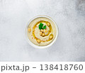 Chickpeas hummus olive oil parsley in white bowl on white background. Healthy vegan food concept 138418760