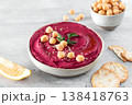 Beetroot hummus with parsley and olive oil in plate on a gray background, top view. Copy space. Arabic, Turkish cuisine. 138418763
