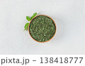 Dried mint leaves in bowl with fresh mint on white background. Top view.  138418777