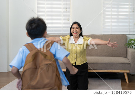 Mother welcoming her son home with open arms 138419579