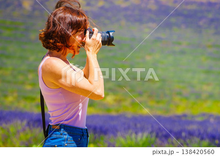 Tourist woman take photo on lavender field, Provence France Tourist woman take photo on lavender field, Provence France 138420560