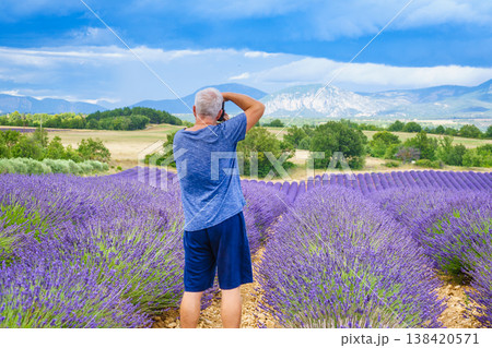 Man take travel photo on lavender field, Provence France Man take travel photo on lavender field, Provence France 138420571