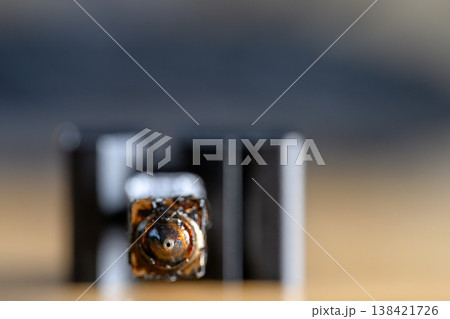 Selective focus on charred and plugged hot end extruder of a 3D filament printer  138421726