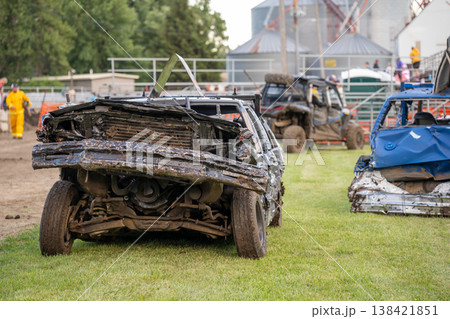 Old cars are ready for a demolition derby event at a fairground in summer at a local community gathering near the grandstand area Old cars are ready for a demolition derby event at a fairground in summer at a local community gathering near the grandstand area 138421851
