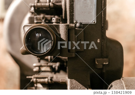 Vintage Industrial Film Projector Machine with Lens and Metal Body Vintage Industrial Film Projector Machine with Lens and Metal Body 138421909
