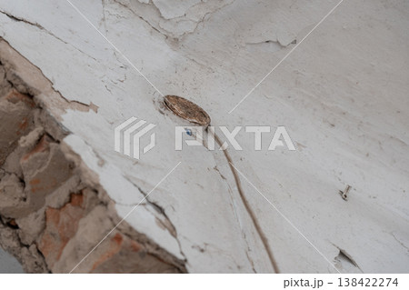 Weathered White Wall With Peeling Paint Exposing Brick And Rusty Screw Detail In High Contrast Texture Photography Style Weathered White Wall With Peeling Paint Exposing Brick And Rusty Screw Detail In High Contrast Texture Photography Style 138422274