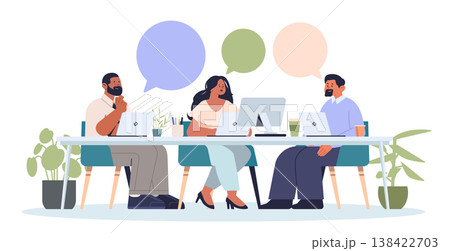 Business meeting teamwork office discussion collaboration diverse team working at desk with laptops plants speech bubbles modern workplace 138422703