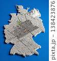 Miniature cityscape shaped as Germany map on flat background - ai generated 138423876