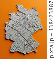 Miniature cityscape shaped as Germany map on flat background - ai generated 138423887