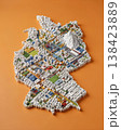 Miniature cityscape shaped as Germany map on flat background - ai generated 138423889