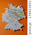 Miniature cityscape shaped as Germany map on flat background - ai generated 138423891