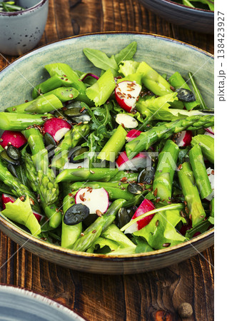 Healthy green salad with asparagus radish and flaxseed Healthy green salad with asparagus radish and flaxseed 138423927