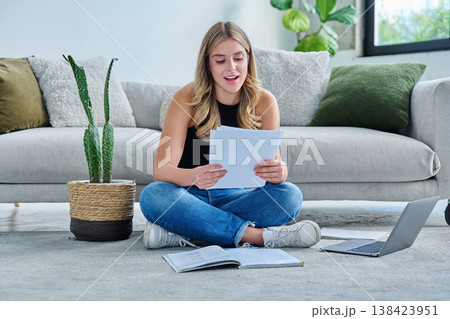 Smiling happy young woman with business important papers in home interior Smiling happy young woman with business important papers in home interior 138423951