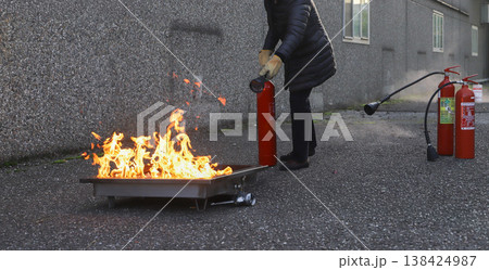 fire prevention. corporate safety - exercise during a firefighting course fire prevention. corporate safety - exercise during a firefighting course 138424987