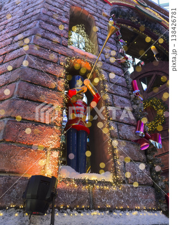 Traditional Christmas nutcracker soldier figurine holding a trumpet as a festive holiday decoration. 138426781