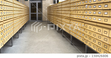 Archive interior with rows of vintage boxes and document storage in a museum or library setting. 138426806