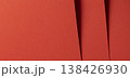 Vibrant orange red designer paper forms a bold saturated background. Smooth matte satin surface 138426930