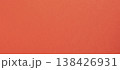 Vivid orange red paper, background with refined warmth. Smooth satin surface shows subtle metallic 138426931