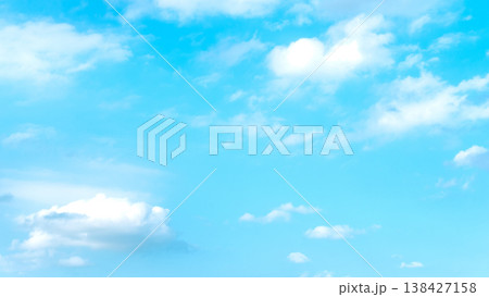 Clear blue sky with soft white clouds 138427158