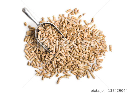 Wood Pellets With Metal Scoop Pile Biomass Fuel For Heating And Renewable Energy Applications 138429044