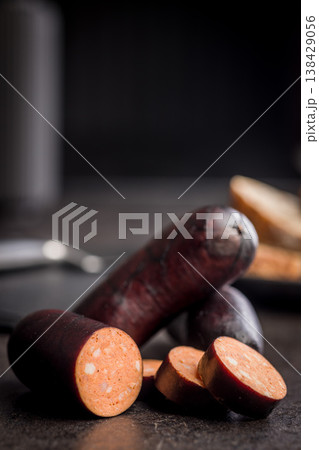 Smoked Sausage With Dark Casing Sliced Closeup on Rustic Surface, Deli Meat Appetizer Smoked Sausage With Dark Casing Sliced Closeup on Rustic Surface, Deli Meat Appetizer 138429056