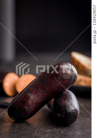 Smoked Sausage With Dark Casing Sliced Closeup on Rustic Surface, Deli Meat Appetizer Smoked Sausage With Dark Casing Sliced Closeup on Rustic Surface, Deli Meat Appetizer 138429057