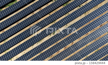 Top down aerial view of diagonal solar panel rows 138429444