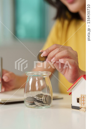 Saving money in a jar for housing and investments Saving money in a jar for housing and investments 138430710