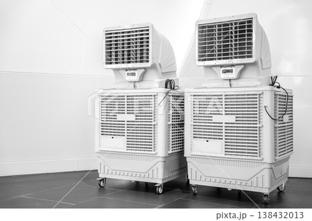 White Evaporative Industrial Air Cooler Portable Type with black fan and wheels isolated on a transparent background. White Evaporative Industrial Air Cooler Portable Type with black fan and wheels isolated on a transparent background. 138432013