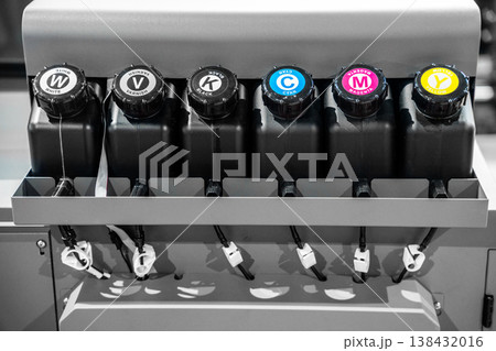 Color CMYK ink tank of a large printer machine in factory for digital printing business. 138432016