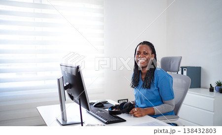 African American female healthcare professional smiling during telehealth consultation African American female healthcare professional smiling during telehealth consultation 138432803