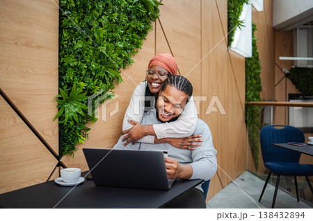 Happy couple enjoying online shopping with laptop and credit card 138432894