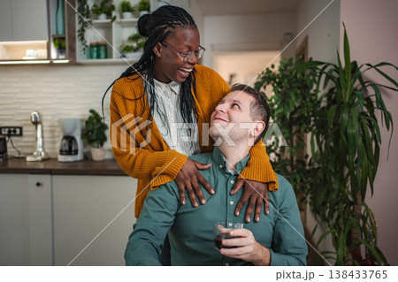 Interracial couple sharing tender loving moment in kitchen Interracial couple sharing tender loving moment in kitchen 138433765