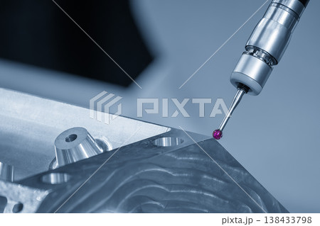 Advanced multi-axis CMM machine measuring a high-precision aluminum engine block for automotive quality inspection. Advanced multi-axis CMM machine measuring a high-precision aluminum engine block for automotive quality inspection. 138433798