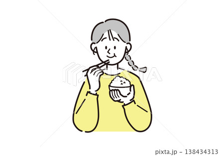 ご飯を食べている女性 138434313