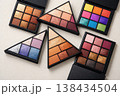 Assortment of colorful eyeshadow palettes arranged in a visually appealing composition 138434504