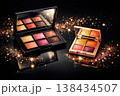 Sparkling eyeshadow palettes with warm tones and glitter accents on a dark background 138434507