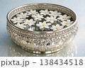 Elegant silver bowl filled with floating white flowers for Songkran celebration 138434518