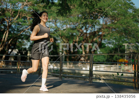 woman running in the park woman running in the park 138435056