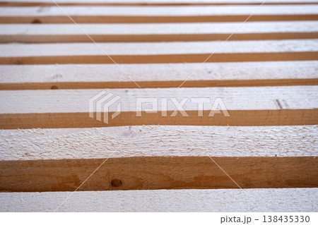 Wooden battens for construction tasks, building frame material, woodworking, installation for wall, ceiling, floor, interior support, finishing projects. Wooden battens for construction tasks, building frame material, woodworking, installation for wall, ceiling, floor, interior support, finishing projects. 138435330